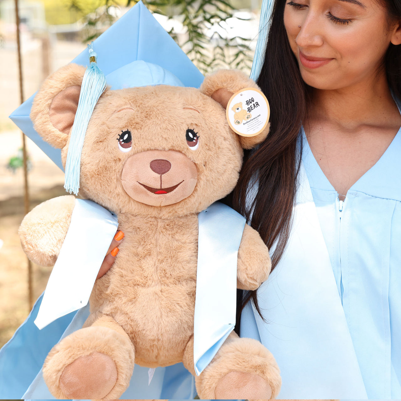graduation teddy bear with sky blue cap and gown