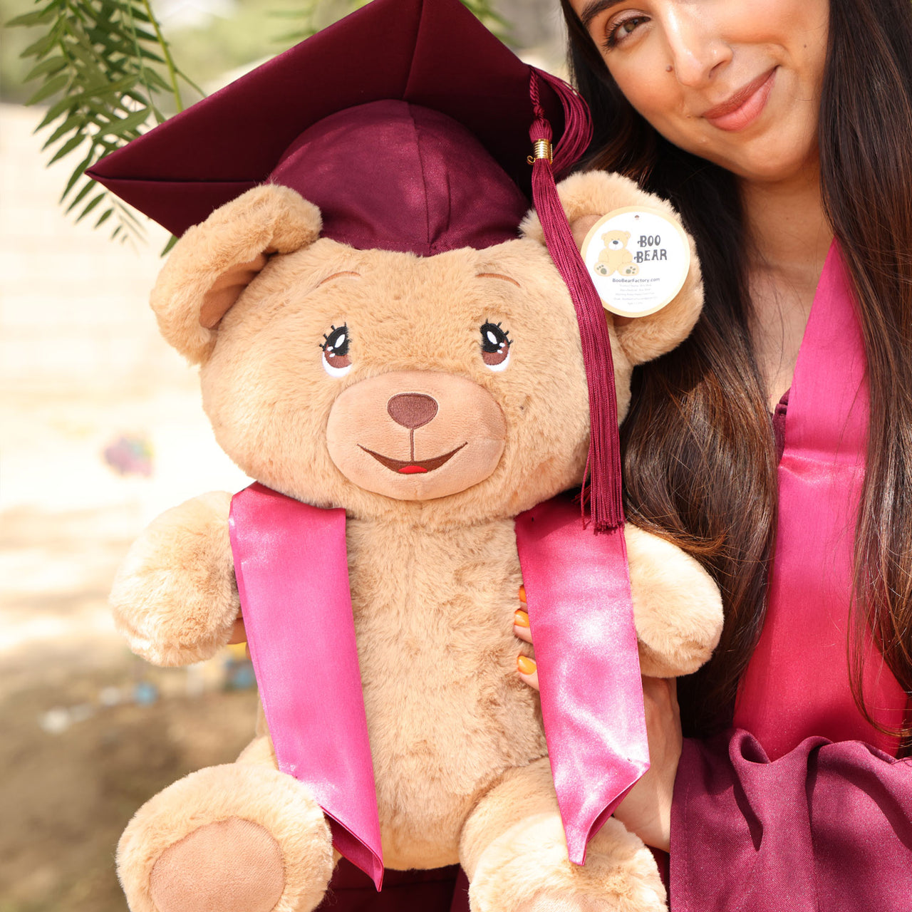 graduation teddy bear with burgundy maroon cap and gown