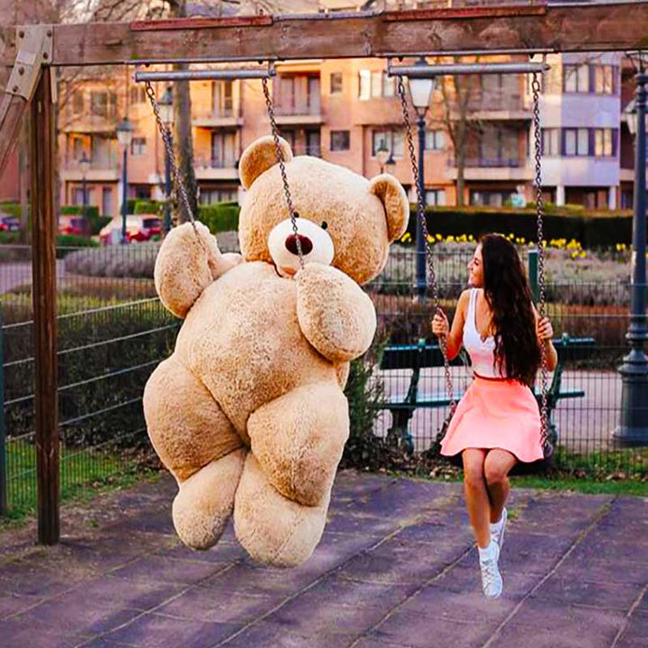 Girl hugging best sale giant teddy bear